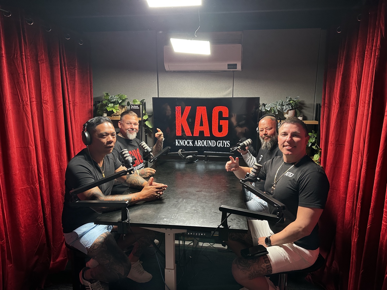 A four-person panel recording a podcast in the studio